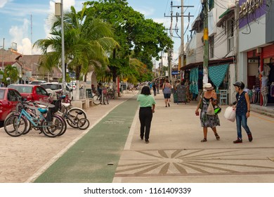 Tulum, Mexico - 7 August 2018: People Walking On The Sidewalk On Avenida Tulum.