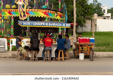 Tulum, Mexico - 7 August 2018: People Eating Tacos At A Colorful Mexican Food Stand.