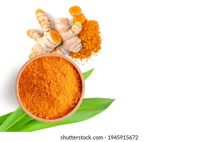 Tumeric root with green leaf and turmeric powder isolated on white background. Top view. Flat lay. 