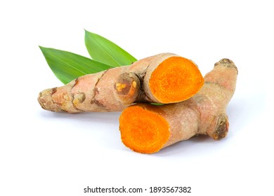 Tumeric ( Turmeric ) root with green leaves isolated on white background. 