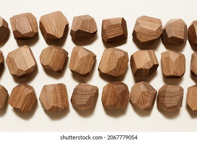 Tumi Ishi Japanese Table Game Meditation, Background From Eco-friendly Wooden Polygonal Stones For Building High Tower, Pattern With Wood Blocks On Beige Paper Background, View From Above.