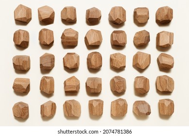 Tumi Ishi Japanese Table Game Meditation, Background From Eco-friendly Wooden Polygonal Stones For Building High Tower, Pattern With Wood Blocks On Beige Paper Background, View From Above. 