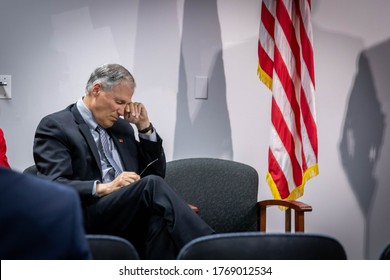 Tumwater, WA / United States - April 26, 2018: Washington State Governor Jay Inslee Rubs His Eyes At An Indoor Speaking Engagement.