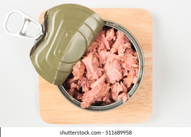 Tuna In Can On Wood Plate On White Background. Tuna Fish Food. Top View