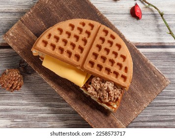 tuna cheese waffle served on wooden board isolated on table top view of dessert - Shutterstock ID 2258573717