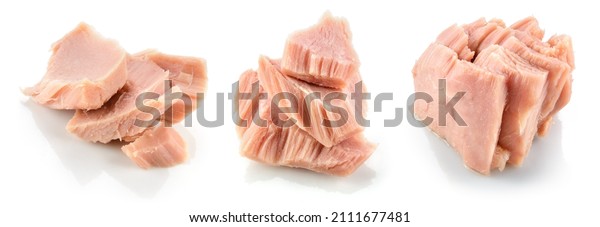 Tuna fish isolated. Canned tuna pieces. Tuna\
can on white background.\
Collection.