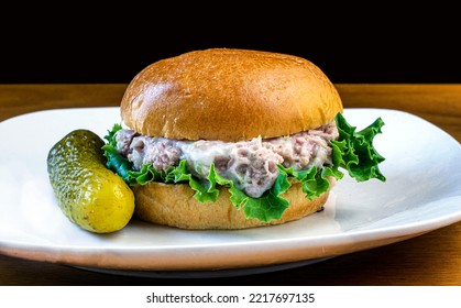 Tuna Fish Salad  On A Brioche  Roll Served With Pickles