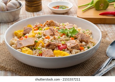 Tuna Fried Rice, Pan Stir Fry Cooked Rice With Canned Tuna Fish ,tomato ,carrot ,peas And Egg.Quick And Easy One Dish Meal On White Plate