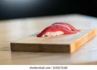 tuna nigiri on wooden cutting board, Japanese cuisine