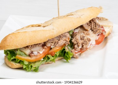 Tuna Salad With Mayo Baguette On A White Tablecloth In A Restaurant