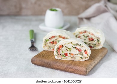 Tuna Salad Roll Sandwich On Wooden Cutting Board. Roll Sandwich With Tuna, Apples And Red Bell Pepper. Thin Armenian Pita Bread Or Lavash. Snack.