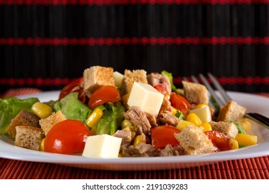 Tuna Salad With Tomatoes, Feta Cheese, Corn And Greens On Plate