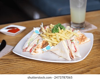 Tuna Sandwich with french fries served in white plate. Selective focus - Powered by Shutterstock