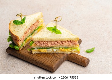 Tuna Sandwiches With Boiled Egg, Mayonnaise, Lettuce On A Wooden Board.