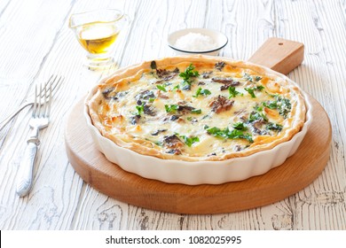 Tuna, Shpinach and Soft Cheese Pie (Quiche) Served on White Pan on White Wood Background. Close up