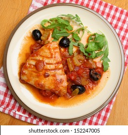 Tuna Steak Poached In Tomato Sauce.