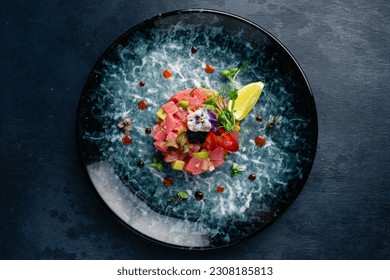 Tuna tartare with avocado, lime, pepper and flying fish caviar.