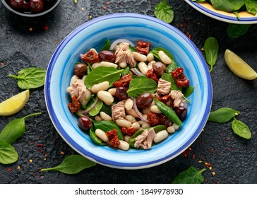 Tuna, White Bean Salad With Olive, Red Onion, Spinach And Dried Tomato. Healthy Food.