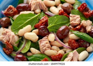 Tuna, White Bean Salad With Olive, Red Onion, Spinach And Dried Tomato. Healthy Food.