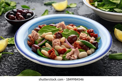 Tuna, White Bean Salad With Olive, Red Onion, Spinach And Dried Tomato. Healthy Food.