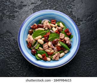 Tuna, White Bean Salad With Olive, Red Onion, Spinach And Dried Tomato. Healthy Food.