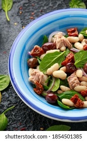 Tuna, White Bean Salad With Olive, Red Onion, Spinach And Dried Tomato. Healthy Food.