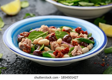 Tuna, White Bean Salad With Olive, Red Onion, Spinach And Dried Tomato. Healthy Food.