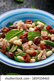 Tuna, White Bean Salad With Olive, Red Onion, Spinach And Dried Tomato. Healthy Food.