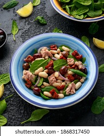 Tuna, White Bean Salad With Olive, Red Onion, Spinach And Dried Tomato. Healthy Food.