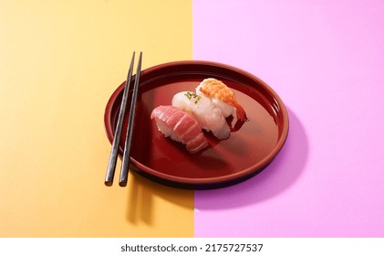 Tuna Yellow Tail  Salmon  Sushi Platetter On Colour Background