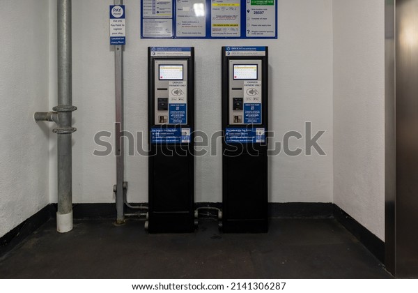 Tunbridge Wells, Kent,\
United Kingdom - March 15th 2022: Two parking payment machines in a\
multistorey car park