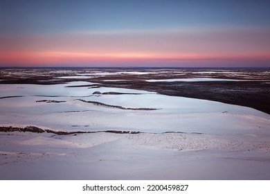 Tundra Horizon With Snow At Sunset