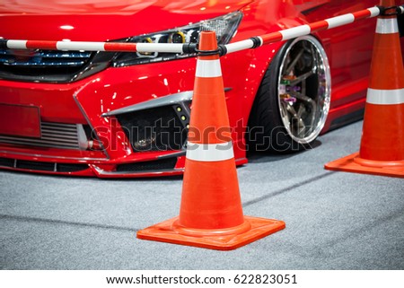 Tuned customized car in parking with cone partition
