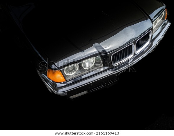 tuner car frontal body part, grille,\
headlamp dan hood in black background.\
