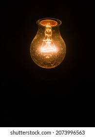 Tungsten incandescent lamp isolated on black background.