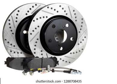 Tuning the brake system of the car. Perforated brake discs, ceramic pads and reinforced hoses - all for better braking.brake disc, pad and reinforced brake hose on a white background - Shutterstock ID 1288708435