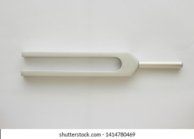 Tuning Fork For Ear Test Of ENT Doctor Or Sound Wave Maker On White Background