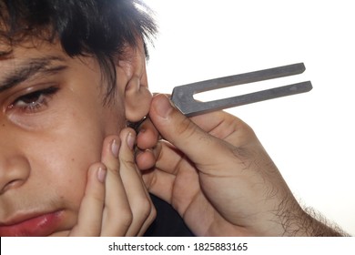 Tuning Fork Used To Perform Sound Test With White Background