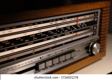 Tuning An Old Vintage Analogic Wooden Radio Dial. Close-up. Radio Frequency Receiver.