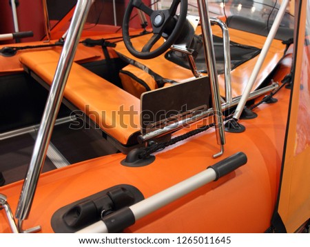 Tuning orange inflatable PVC motor boat - steering wheel console, paddle with rowlock, seat, fishing table and bow awning