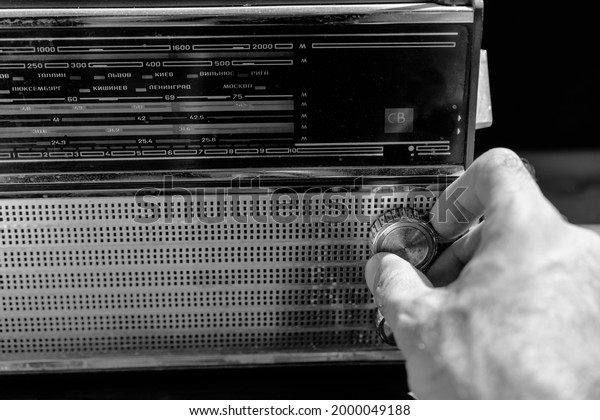 Tuning the radio to a radio\
station