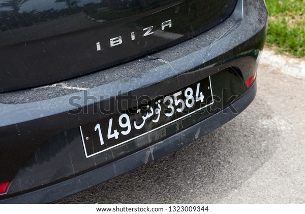 TUNISIA, AFRICA-CIRCA MAY, 2012:
Tunisian car registration number plate with black frame is on
automobile bumper. It is consists from numbers and arabic
symbols
