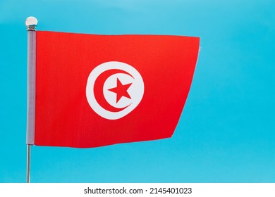 Tunisian Flag Waving On Blue Background Stock Photo 2145401023 ...