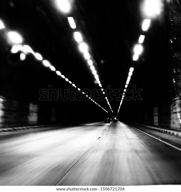 It is a\
tunnel clicked in back and white\
filter