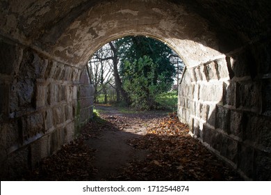 Tunnel With Light At The End, There Is Hope At The End, Stone Wall Tunnel. Dark In The Beginning