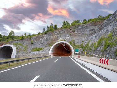 Tunnel on a highway. A tunnel in a mountain on a country highway. - Powered by Shutterstock