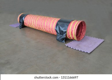 A Tunnel On An Indoor Dog Training Agility Course.