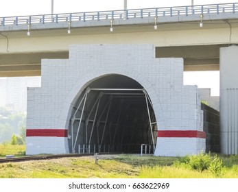 Tunnel On The Railway Tracks Under The Bridge. Tunnel Construction.