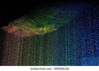Tunnel rainbow of LED lights garland or many small lantern festival,colorful lighting bulbs decorated to curtain lamp on a bokeh with dark night background on Christmas day or Happy new year holiday.