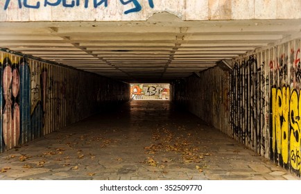 The tunnel underground pedestrian crossing with pictures of graffiti on the walls. The original light-shadow gradation. Ideal for the creative design of stage. Selective focus. - Powered by Shutterstock